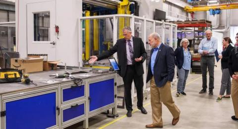Industry tour group learning about UNH Olson Center facilities