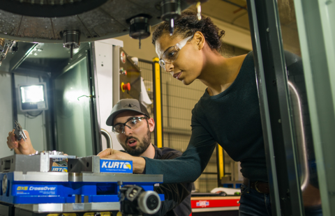 UNH researchers work with machining equipment