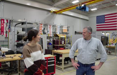 Maria Virga, process engineer at GreenSource Fabrication, speaks with John Roth, director of the Olson Center